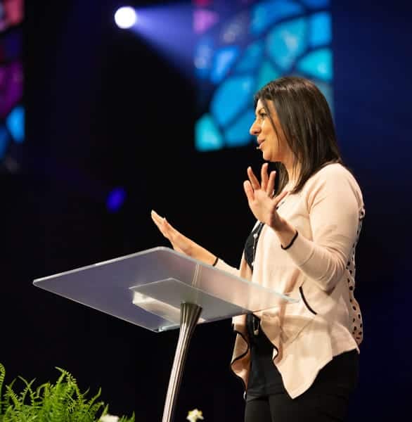 Photo of Debra at a speaking event